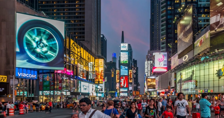 Digital media displays on the sides of buildings in an urban setting
