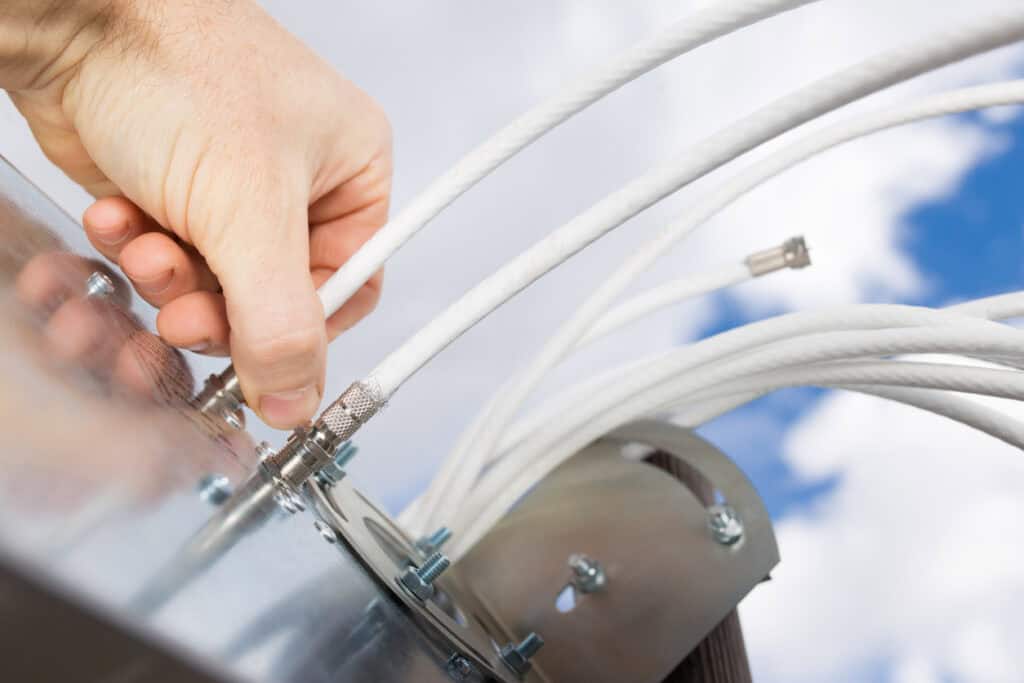 High-tech industrial device with multiple white cables connected for IoT connectivity.